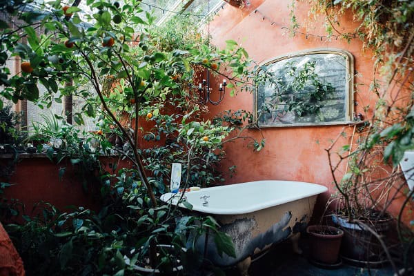 A bath situatied in the shared area of the farmhouse at Old Chapel Farm