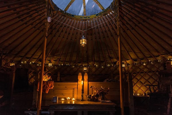 Francesca Cassini starts the fire in her Yurt near Llandinam, North Wales