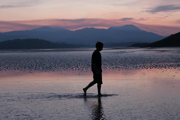 The sun sets over mud flats near Auchencairn in Dumfries and Galloway, Scotland. Photo by Lucy Purdy