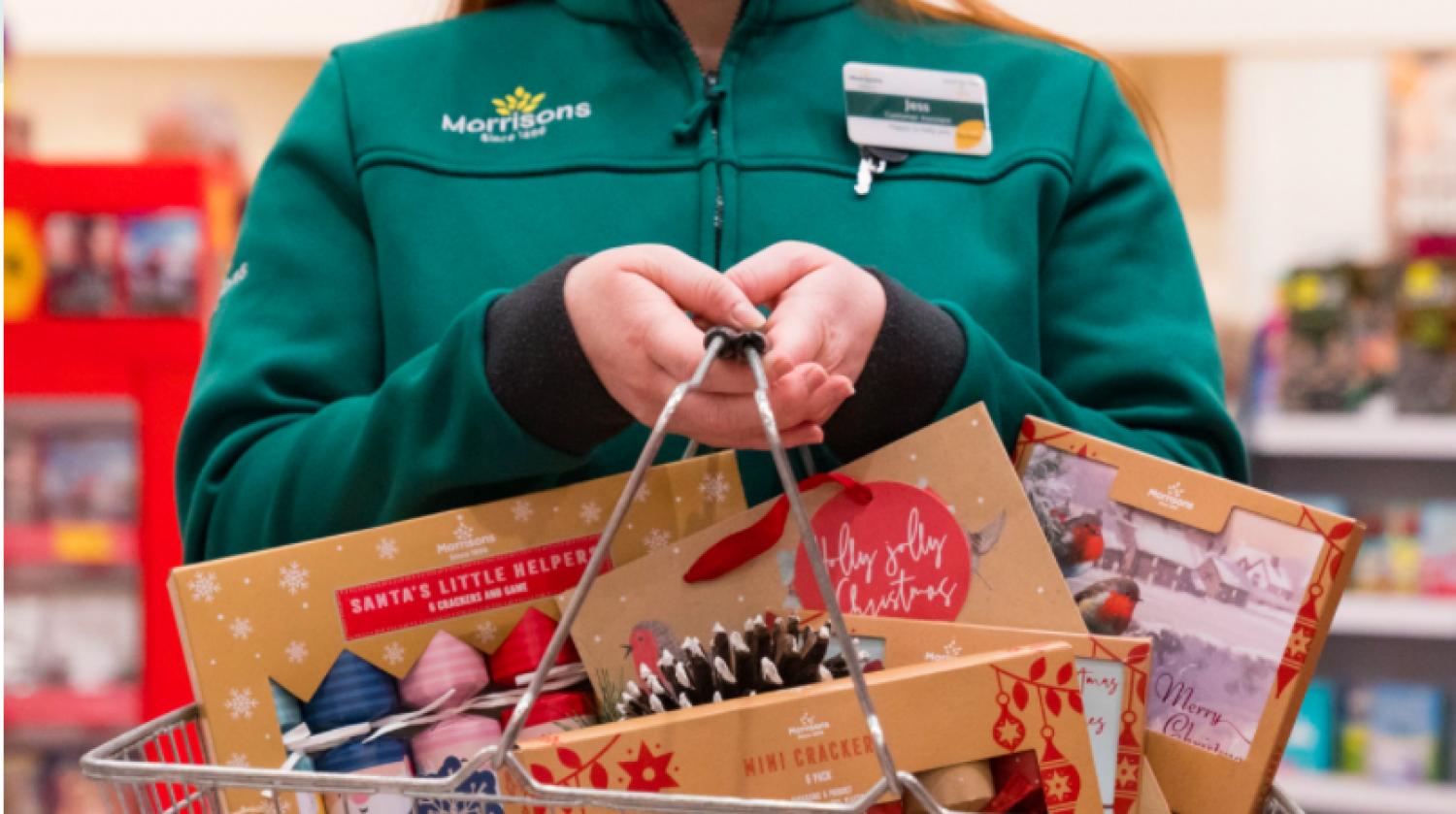 Supermarket clerk with Christmas products