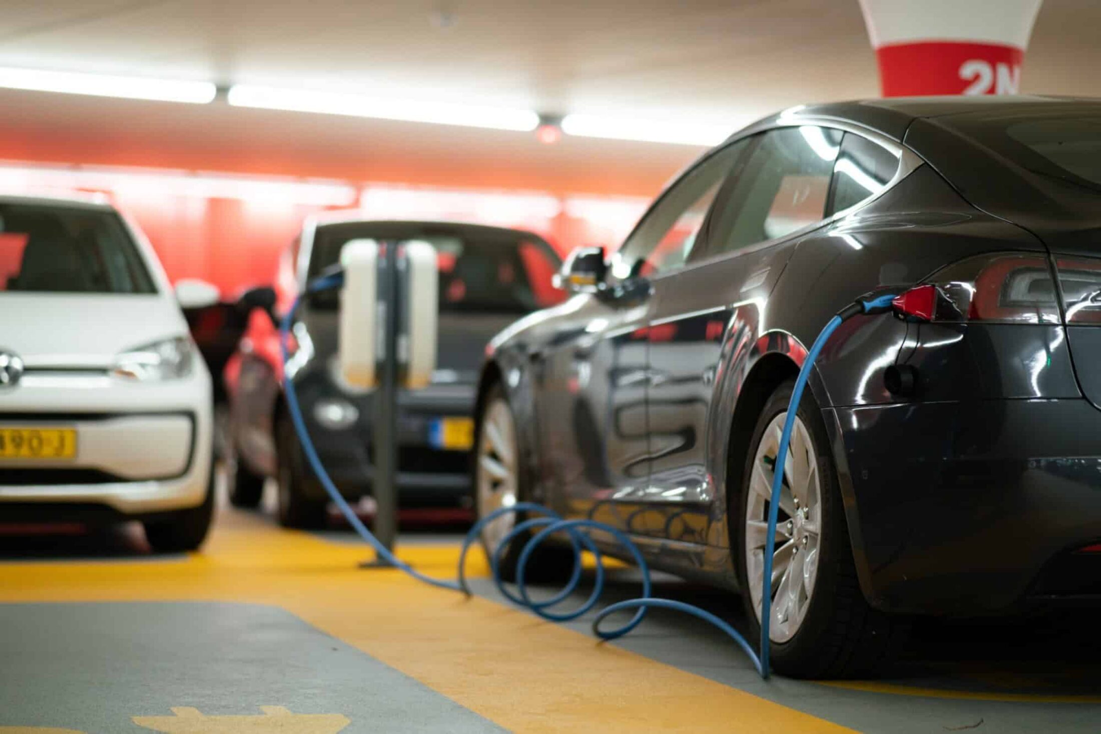 Charging an electric car in a parking lot.