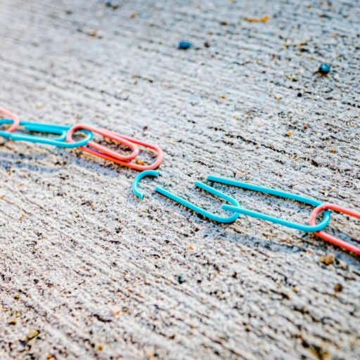 blue green and red plastic clothes pin photo