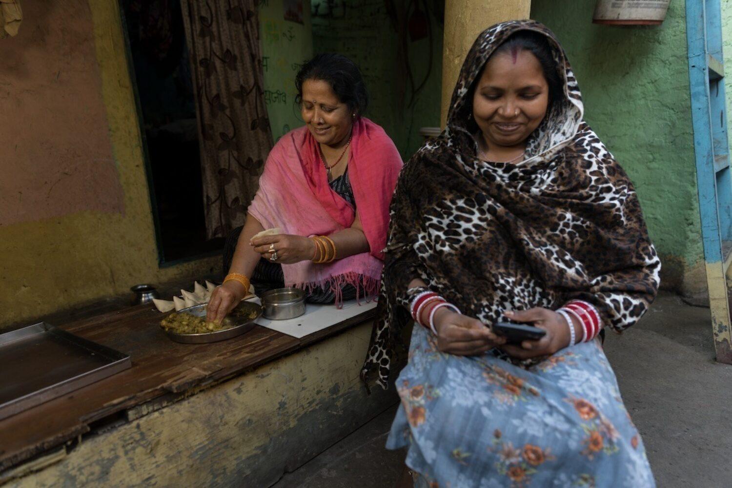 Women make samosas in Delhi